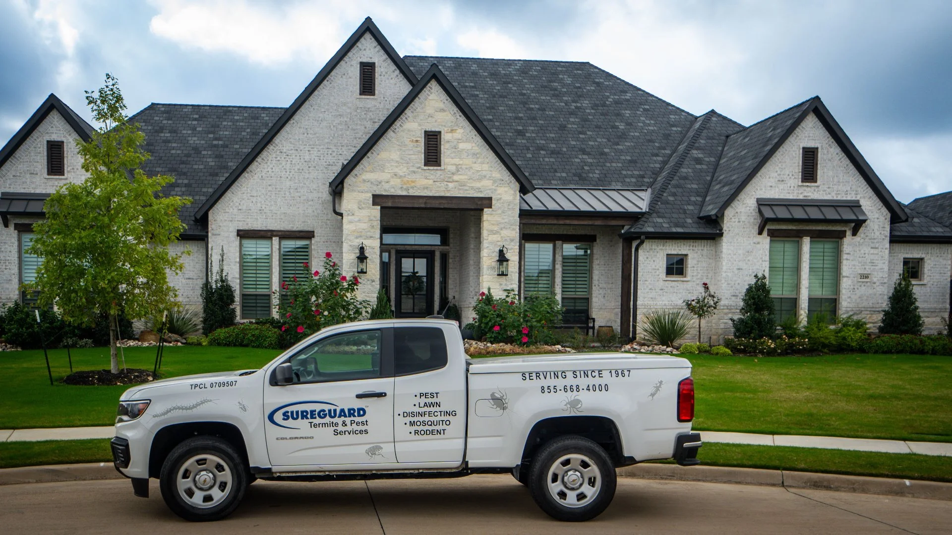 SureGuard company truck with house in background