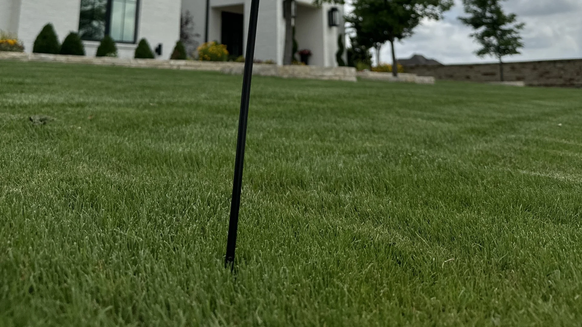 Black post for a front yard sign in Burleson, TX.