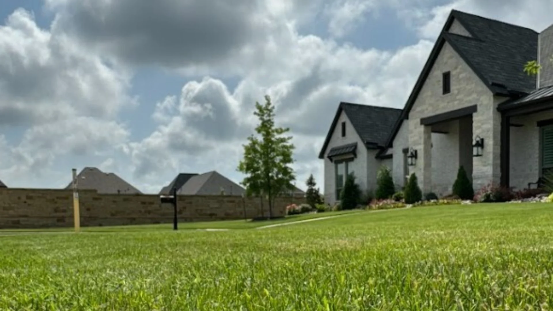 Residential lawn with clouds in the background in Addison, TX.