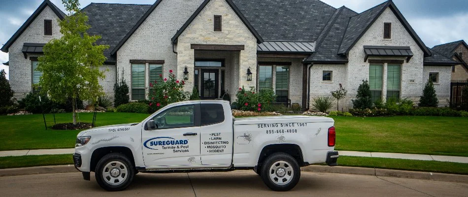 A Sureguard truck in front of a residential property in Dallas, TX.