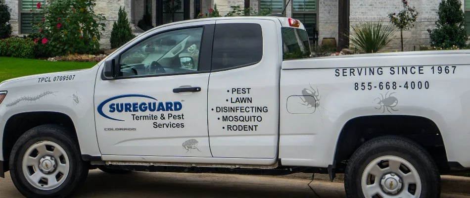 Sureguard Lawn & Pest truck at a customer's home in Dallas, TX.